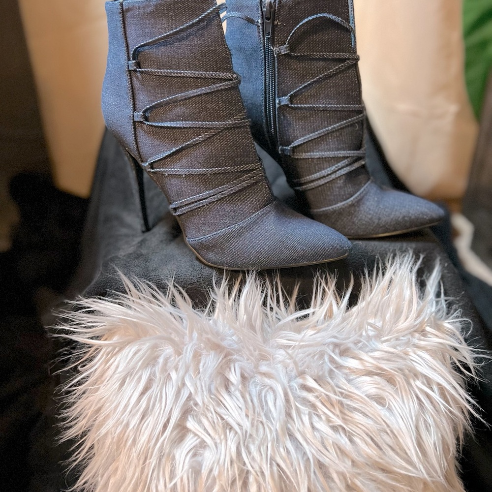 Jean booties, never worn!! Heel size is 4 1/2 in.  No box